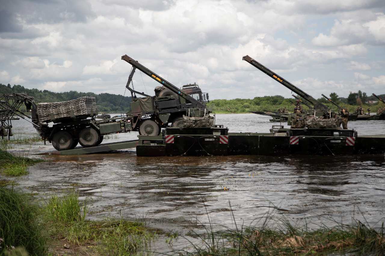 Photo: US Army truck drives onto amphibious rig on the river Neman in Lithuania during US-led exercise Saber Strike 18 taking place across the Baltics and Poland. It involves around 18,000 troops from 19 NATO Allies and partners. The exercise is aimed at building readiness in an integrated training environment. Credit: NATO