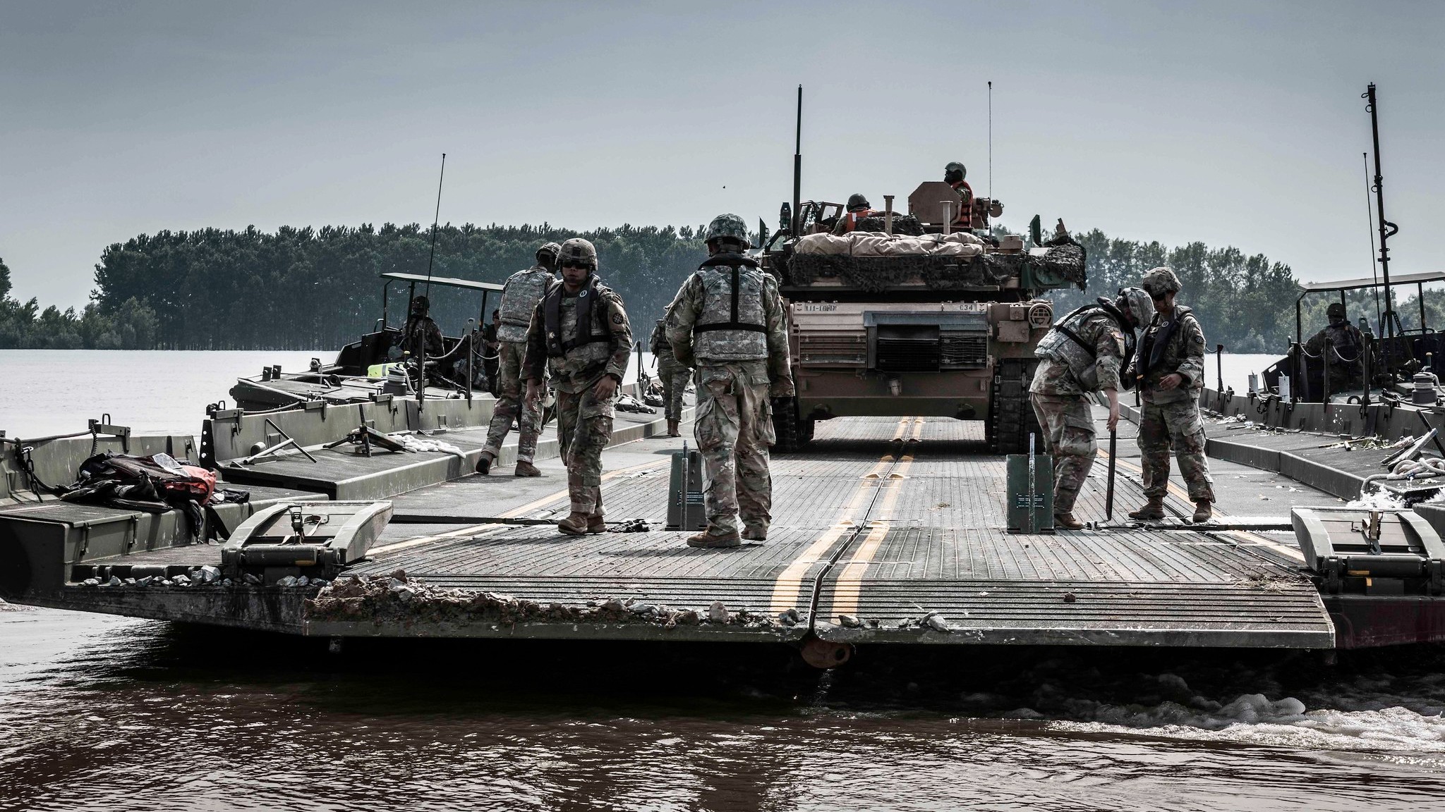 Photo: A U.S. Army M1 Abrams tank is transported across the Danube River in Romania during Exercise Saber Guardian 2019. The exercise includes more than 8,000 soldiers from six NATO Allied and partner nations. It's co-led by Romanian Land Forces and U.S. Army Europe. Credit: NATO