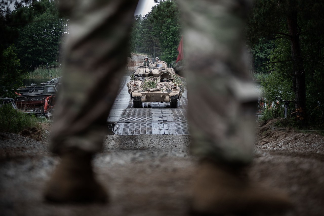Photo: A US Army Bradley fighting vehicle crosses a Polish floating bridge at Z?y ??g lake during Exercise Allied Spirit. Part of DEFENDER-Europe 20 Plus, Allied Spirit brings together more than 6,000 Polish and US Army troops for combat and mobility drills. Credit: NATO