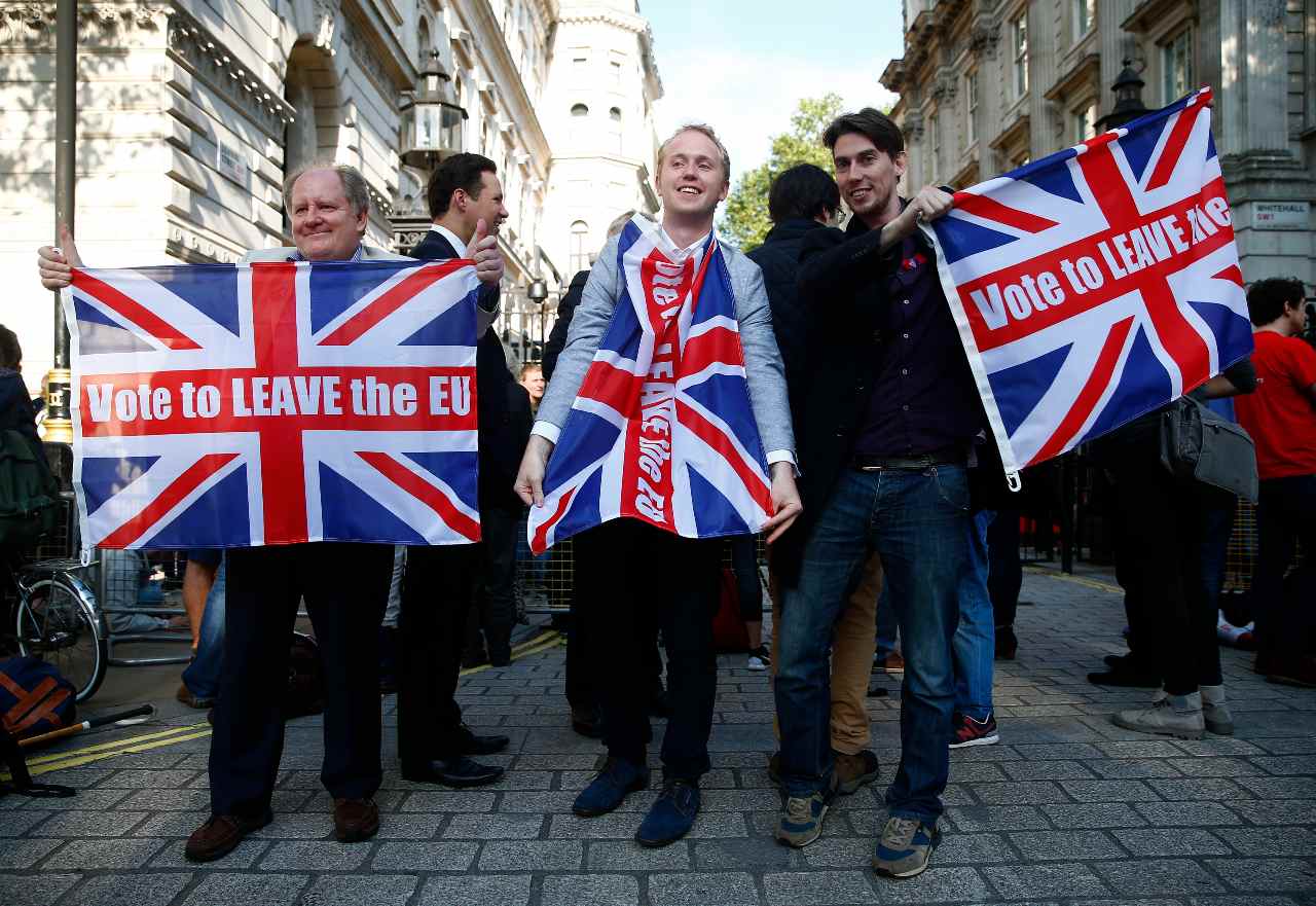 Vote leave supporters wave Union flags, following the result of the EU referendum, outside Downing Street in London, Britain June 24, 2016.