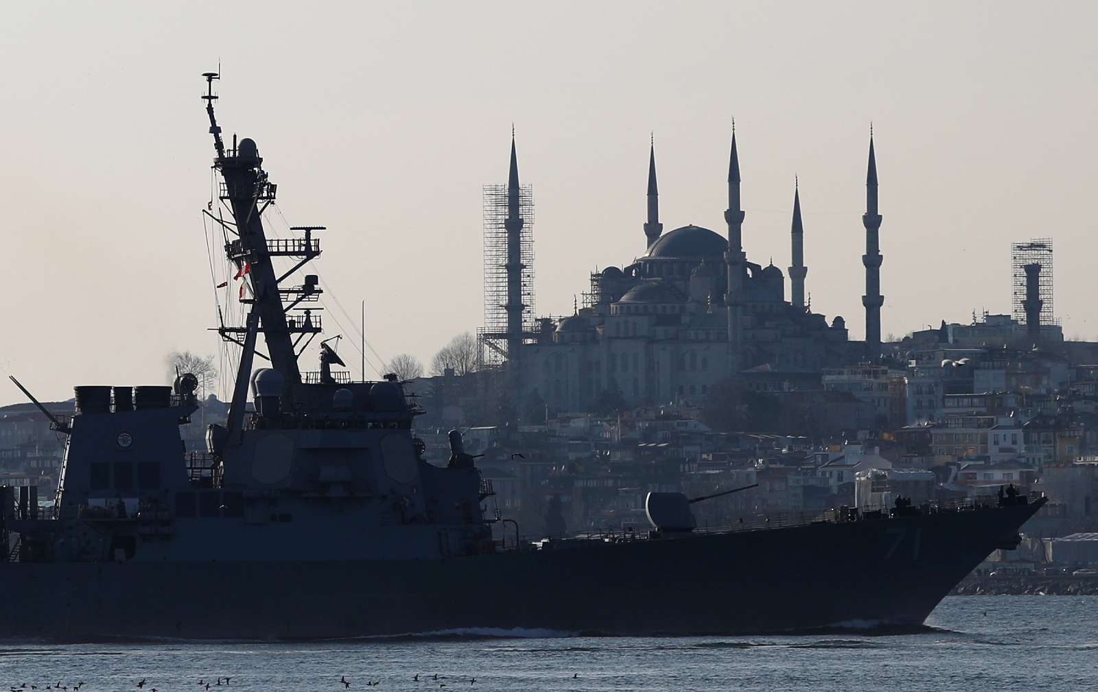 U.S. Navy guided-missile destroyer USS Ross, with the Blue mosque in the background, sails in the Bosphorus, on its way to the Black Sea, in Istanbul, Turkey, February 23, 2020. REUTERS/Murad Sezer