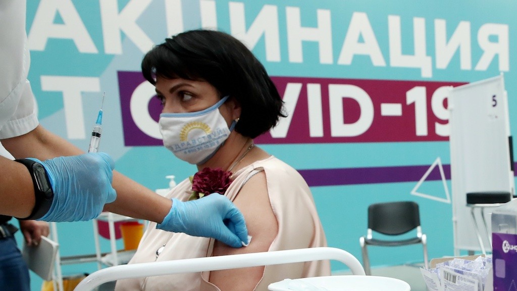 Photo: Irina Borovova, President of the Zdravstvui [Be Healthy] Interregional Association of Oncology Patients, visits the largest Russian COVID-19 vaccination site set up at the Gostiny Dvor Exhibition Centre, oncology patients also given injections. Credit: Anton Novoderezhkin/TASS.