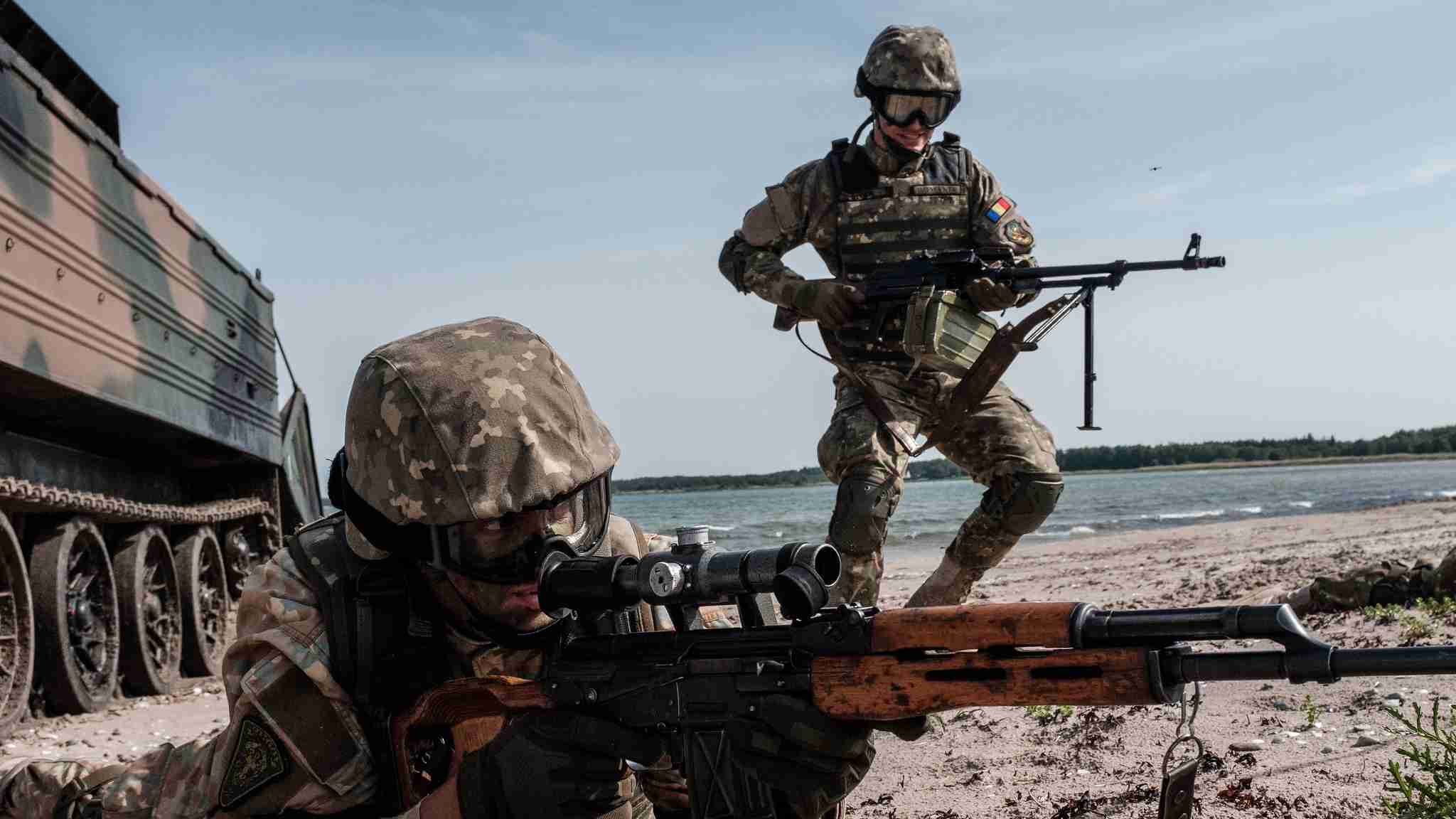 Photo: Romanian Marines storm a beach on Saaremaa Island in Estonia during BALTOPS 2019. An annual US-led exercise involving 16 NATO Allies and two partner nations, BALTOPS focuses on improving maritime interoperability through multinational amphibious operations in the Baltic Sea region. Credit: NATO