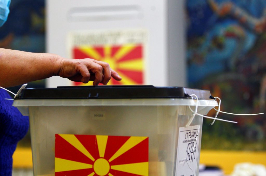 Photo: A person casts his ballot at a polling station during the general election, after planned snap elections in April had to be postponed due to the coronavirus disease (COVID-19) outbreak, in Strumica, North Macedonia, July 15, 2020. Credit: REUTERS/Ognen Teofilovski