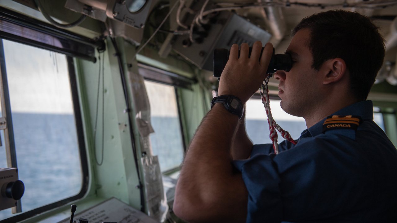 Photo: A Canadian officer of the watch on board HMCS TORONTO, scans the horizon during NATO Bulgarian led exercise BREEZE 19 in the Black Sea region.
Credit: NATO Photo by NIC Edouard Bocquet.