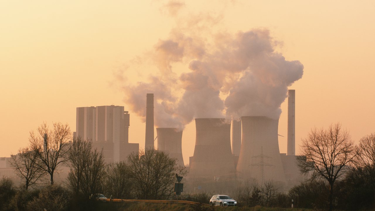Photo: Steam is seen from the cooling towers of German RWE Power AG during sunset time in Weisweiler; Germany on March 24, 2022 Credit: Photo by Ying Tang/NurPhoto