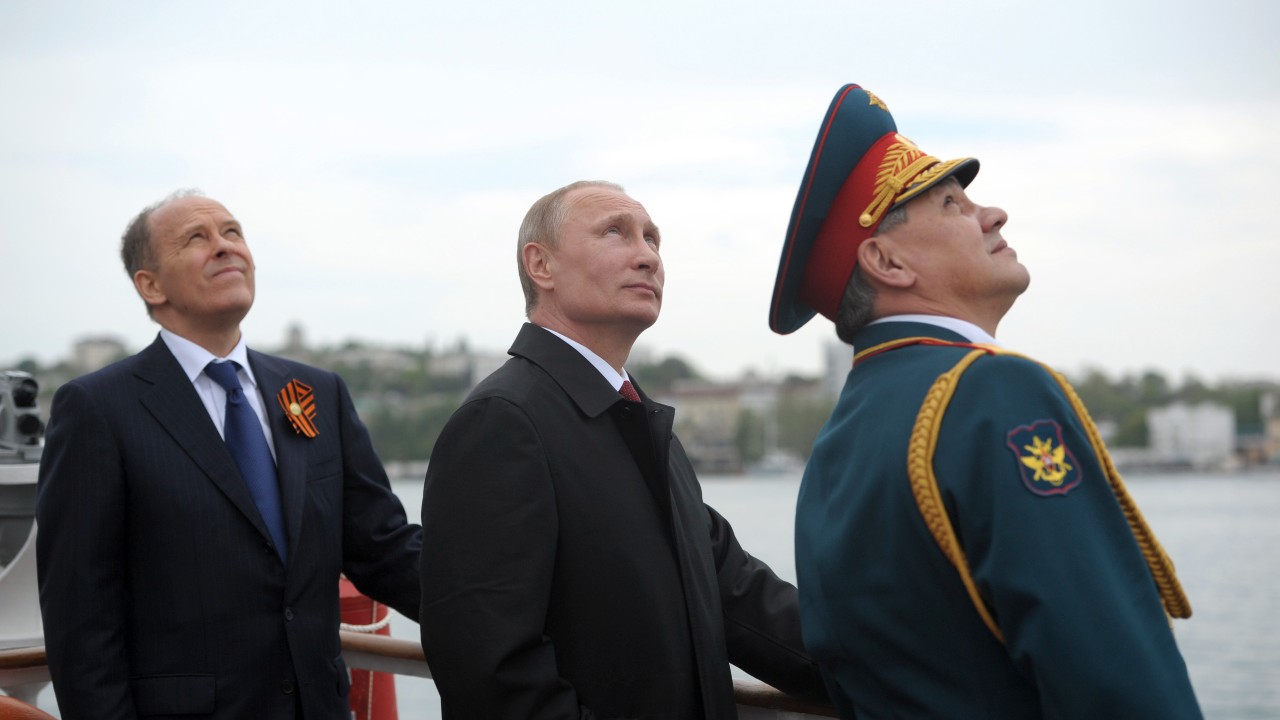 Photo: Russian President Vladimir Putin (C), Russia's Defence Minister Sergei Shoigu (R) and Russia's Federal Security Service (FSB) Director Alexander Bortnikov watch events marking Victory Day, in Sevastopol May 9, 2014. Putin flew in to Crimea on Friday, marking the Soviet victory in World War Two and proclaiming the success of the peninsula's seizure from a Ukraine that Russia says has been taken over by fascists. Credit: REUTERS/Alexei Druzhinin/RIA Novosti/Kremlin