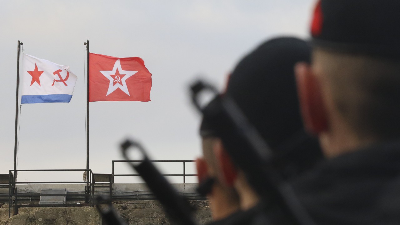 Photo: Russian Marine Corps conscripts stand in formation in front of Soviet Navy flags as they take the oath in the Black Sea port of Sevastopol, Crimea December 9, 2017. Credit: REUTERS/Pavel Rebrov