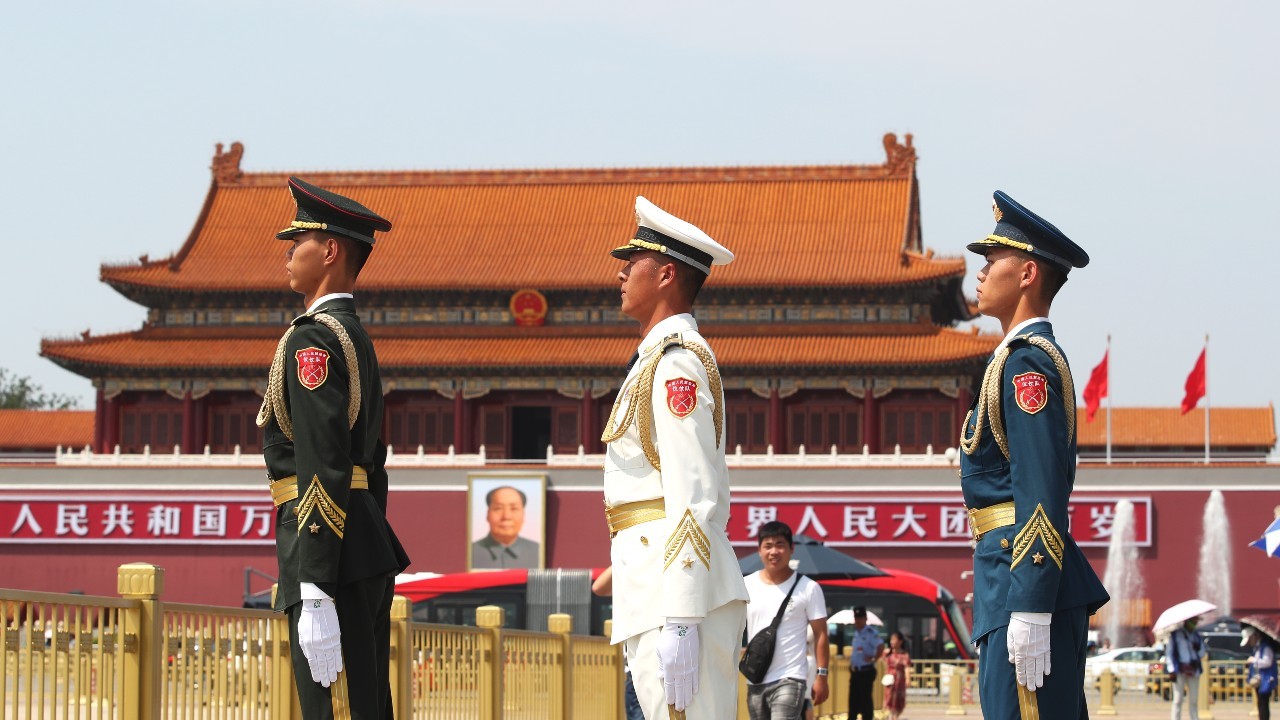 Photo: A soldier, a sailor and an airman patrol at the Tian'anmen Square to commemorate the Army Day of 2019, the 92th anniversary of the establishment of Chinese People's Liberation Army, in Beijing, China, 1 August 2019. Credit: Oriental Image via Reuters Connect