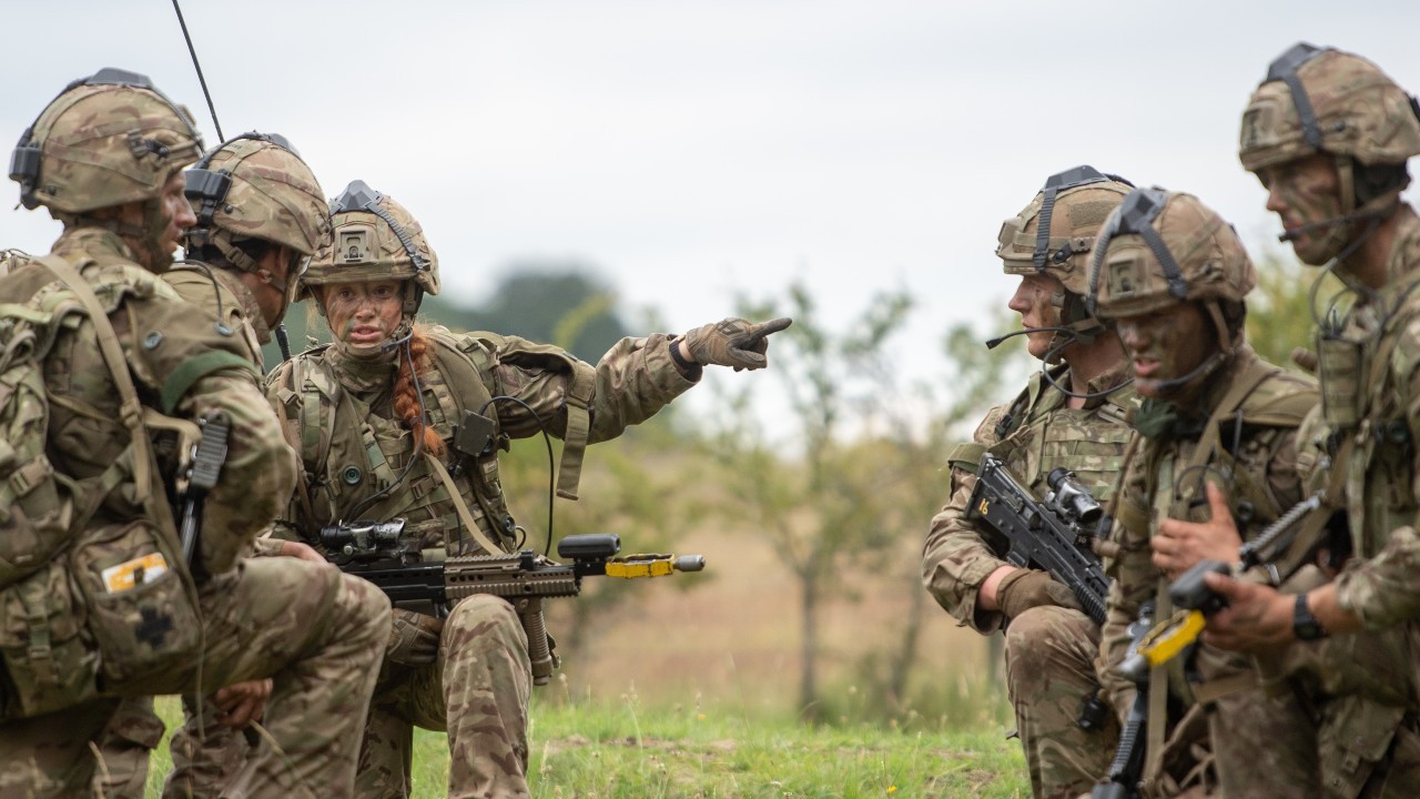 Photo: Officer cadet Peony Grainger, 24, leads a platoon attack in West Tofts Camp, Thetford, Norfolk, during the British Army Exercise Dynamic Victory which is usually held overseas with alongside coalition forces but is taking place in UK due to Covid-19 restrictions. Credit: PA via Reuters