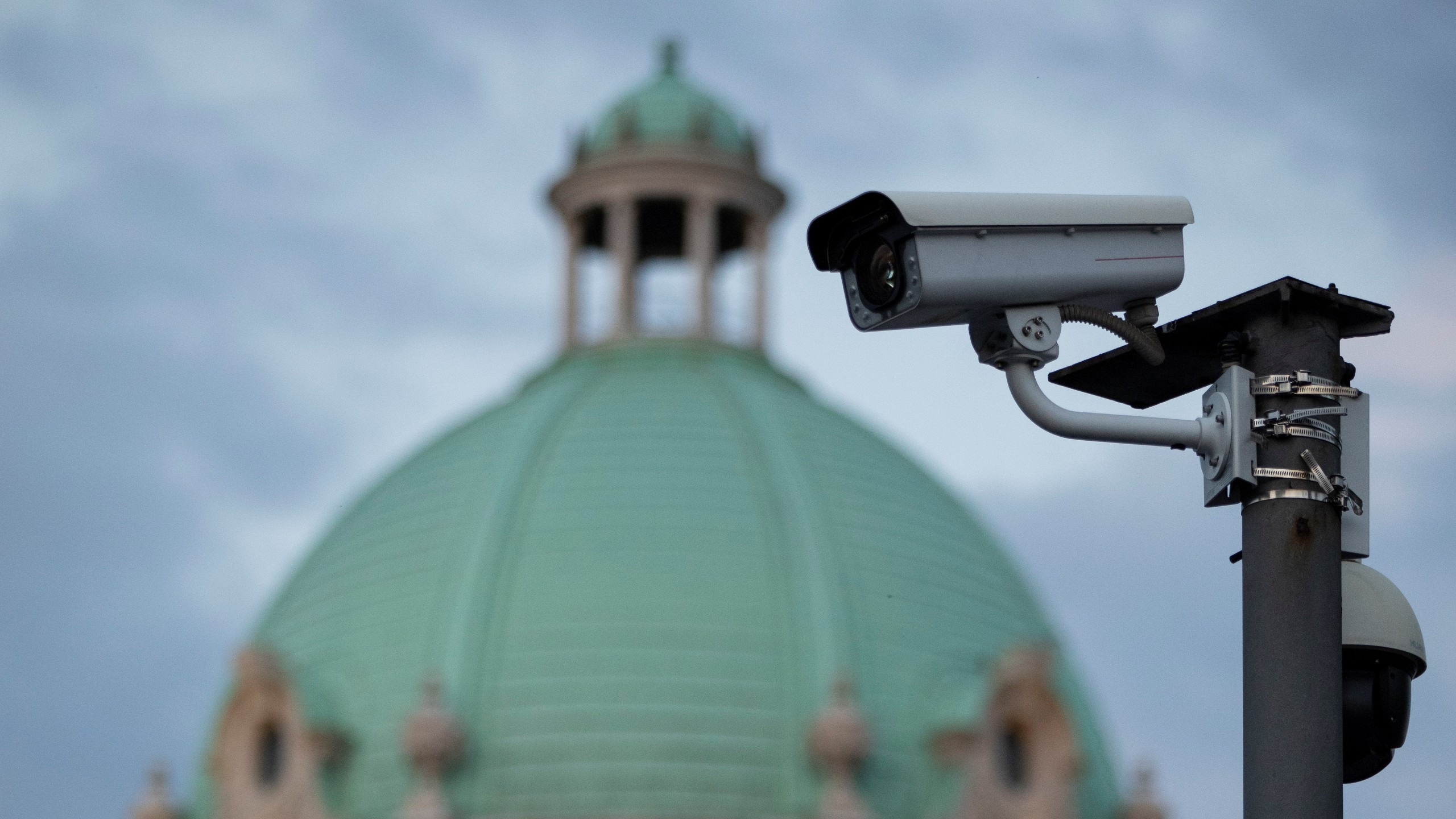 Photo: Surveillance camera is seen in front of the Serbian Parliament building in Belgrade, Serbia, August 12, 2020. Picture taken August 12, 2020. Credit: REUTERS/Marko Djurica