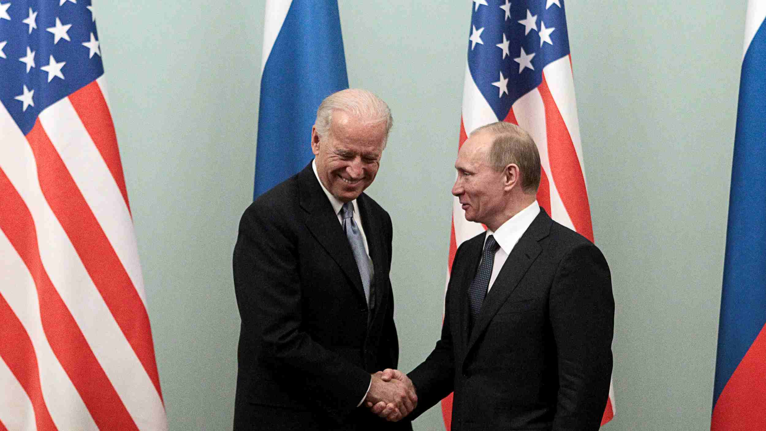 Photo: Russian Prime Minister Vladimir Putin (R) shakes hands with U.S. Vice President Joe Biden during their meeting in Moscow March 10, 2011. Credit: REUTERS/Alexander Natruskin/File Photo