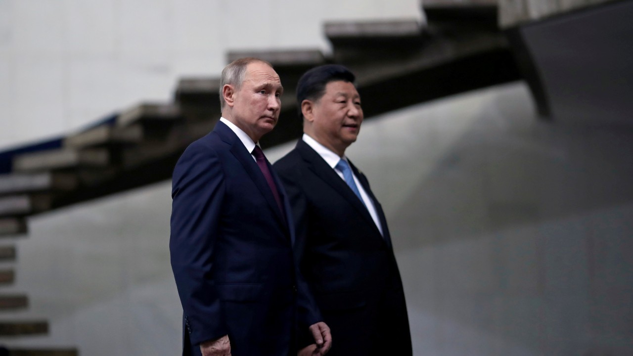 Photo: Russia's President Vladimir Putin and China's Xi Jinping walk down the stairs as they arrive for a BRICS summit in Brasilia, Brazil November 14, 2019. Credit: REUTERS/Ueslei Marcelino/File Photo