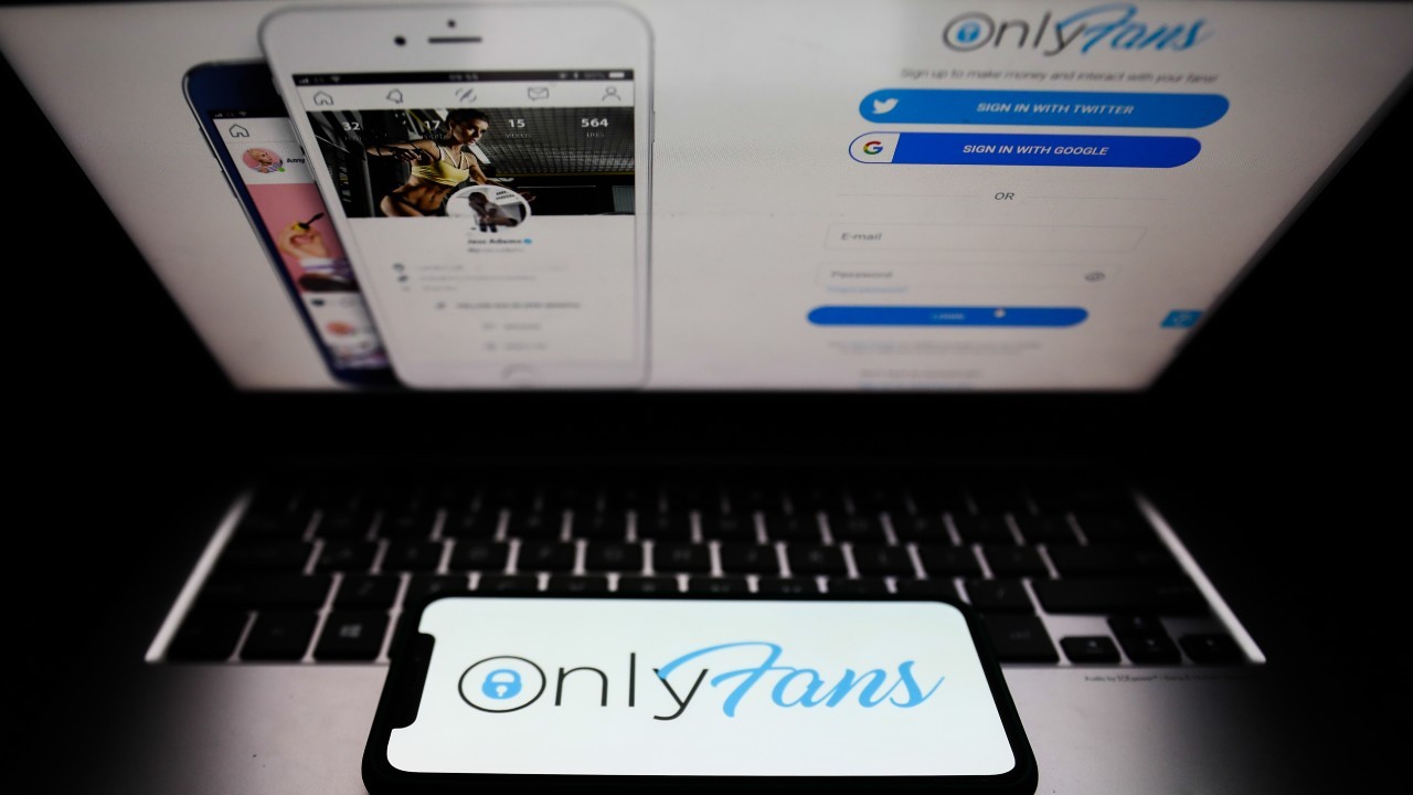Photo: OnlyFans logo displayed on a phone screen and a website displayed on a laptop screen are seen in this illustration photo taken in Krakow, Poland on April 27, 2021. Credit: Jakub Porzycki/NurPhoto