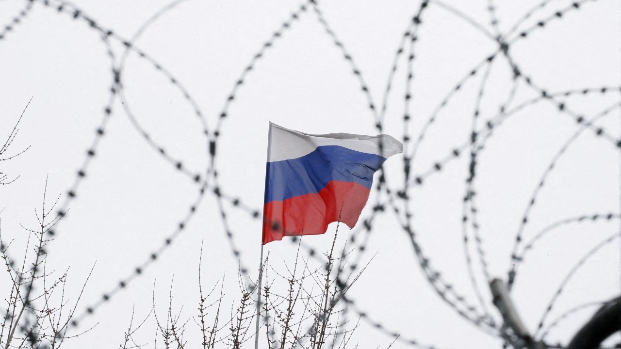 Photo: The Russian flag is seen through barbed wire as it flies on the roof of the Russian embassy in Kiev, Ukraine March 26, 2018. Credit: REUTERS/Gleb Garanich/File Photo