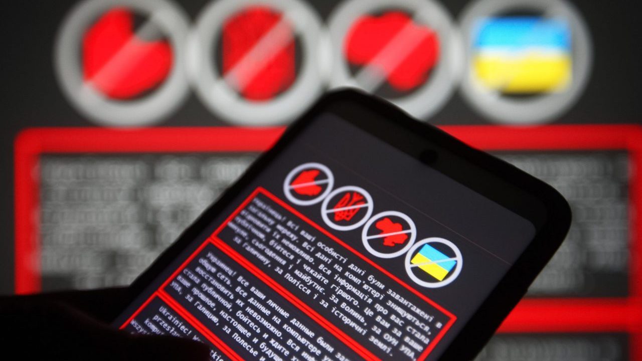 Photo: In this photo illustration, a warning message in Ukrainian, Russian and Polish languages is displayed on a smartphone screen and in the background. Hackers carried out attacks on several of Ukraine's government websites, including the Ministry of Foreign Affairs, the Ministry of Education and Science, the State Service for Emergency Situation, and others, reportedly by local media. This attack, on Ukrainian government web resources, is the largest in the last four years. Credit: Photo by Pavlo Gonchar / SOPA Images/Sipa USA.
