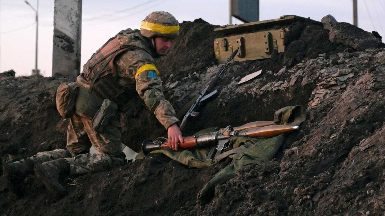 Photo: A Ukrainian serviceman holds a rocket-propelled grenade (RPG) launcher at fighting positions outside the city of Kharkiv, Ukraine February 24, 2022.  Credit: REUTERS/Maksim Levin