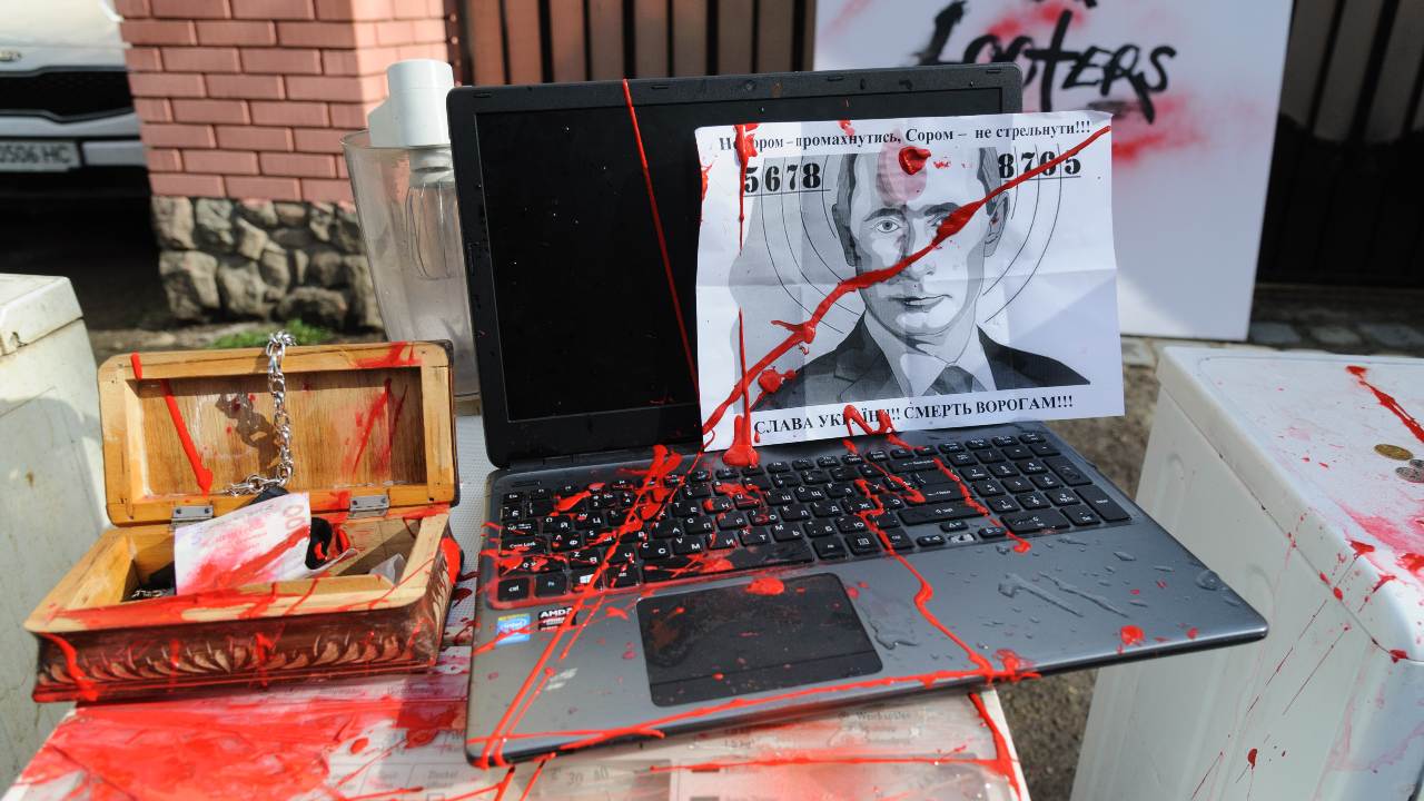 Photo: A laptop with portrait of Vladimir Putin, parts of office equipment and household appliances symbolizing those that Russian soldiers stole in occupied Ukrainian territories, spattered with red paint at the Consulate of the Russian Federation during a protest 'Russian army - is a mob of murderers, rapists and looters'. Credit: Mykola Tys / SOPA Images/Sipa USA