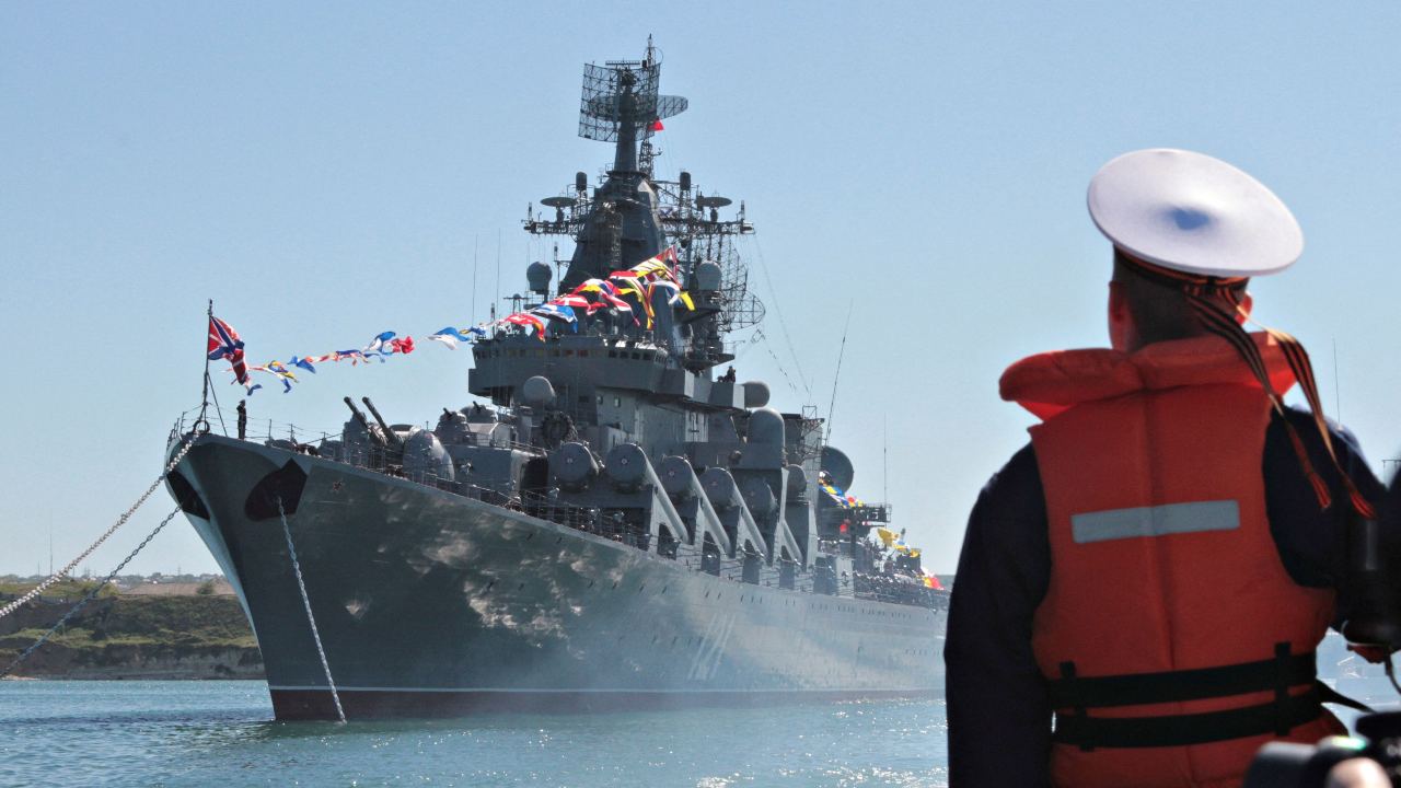 Photo: A sailor looks at the Russian missile cruiser Moskva moored in the Ukrainian Black Sea port of Sevastopol, Ukraine 10, 2013. Credit: REUTERS/Stringer/File Photo.