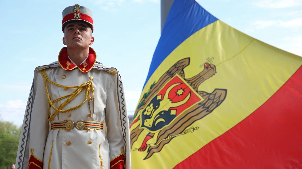 Photo: A member of the guard of honor holds the Moldovan flag during a ceremony marking the State Flag Day in Chisinau, Moldova April 27, 2022. Credit: REUTERS/Vladislav Culiomza