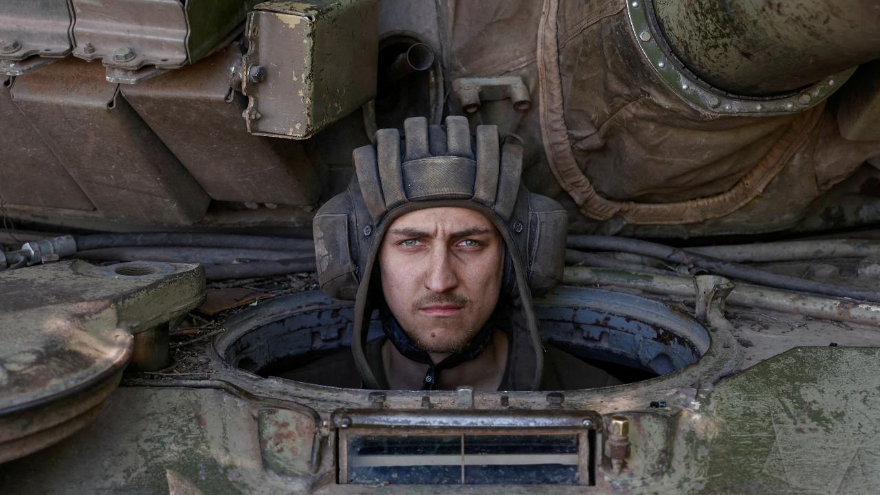 Photo: A Ukrainian serviceman looks on from inside a tank at a position in Donetsk region, as Russia's attack on Ukraine continues, Ukraine June 11, 2022. Picture taken June 11, 2022. Credit: REUTERS/Stringer