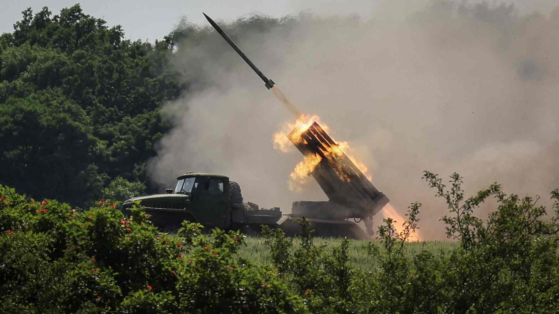 Photo: Ukrainian service members fire a BM-21 Grad multiple rocket launch system, near the town of Lysychansk, Luhansk region, amid Russia's attack on Ukraine June 12, 2022. Credit: REUTERS/Gleb Garanich