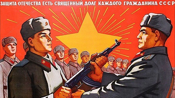 Photo: “The defence of the motherland is a sacred duty of every citizen of the USSR. Learn to master firearms!” — Soviet poster published in 1961 showing an officer passing a Kalashnikov to a younger soldier. The poster was designed by R. Dementiev and published by the Ministry of Defence. Translation and info courtesy of @antikbar.co.uk. Credit: @Propagandopolis via Instagram.