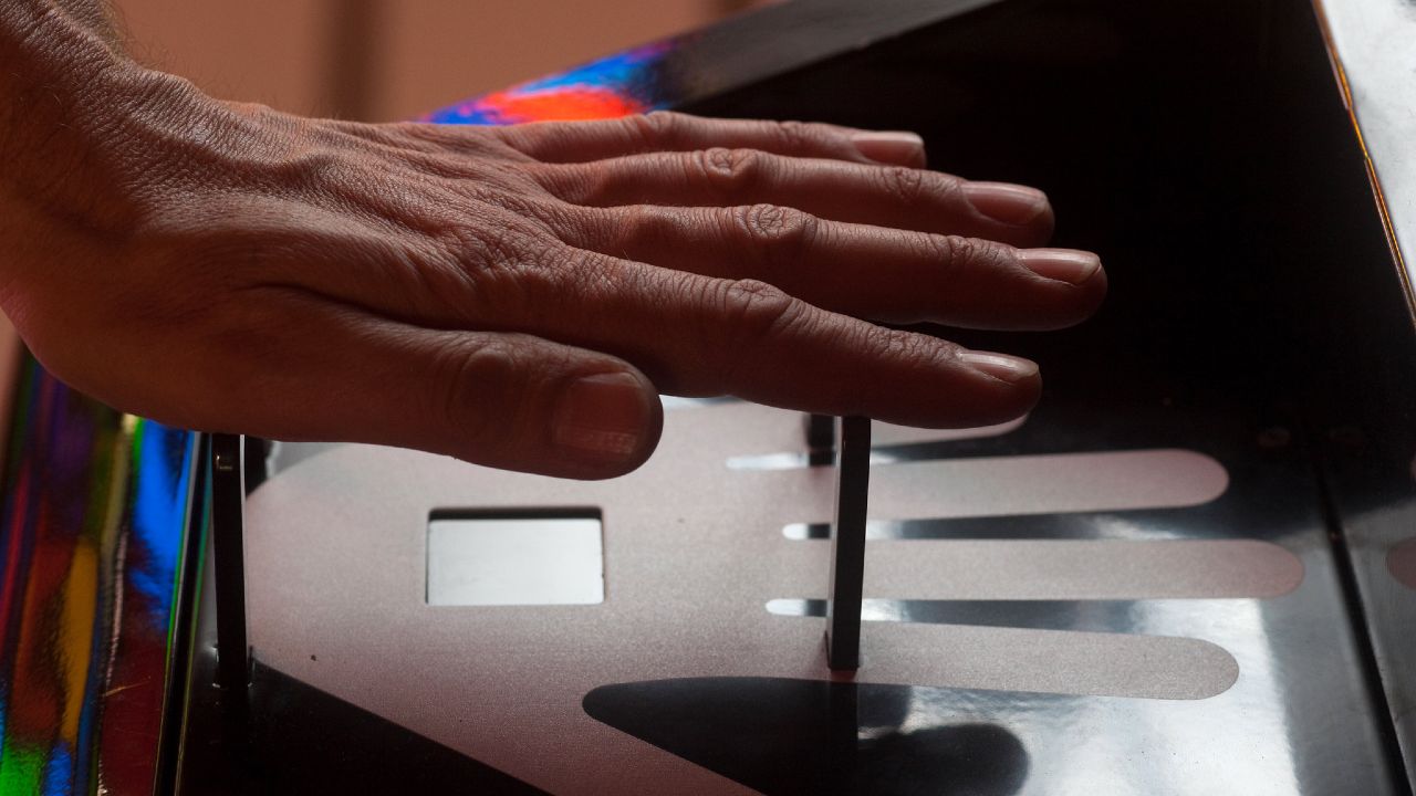 Photo: Biometric security, non-contact hand scan. Credit: Worklife Siemens/Flikr