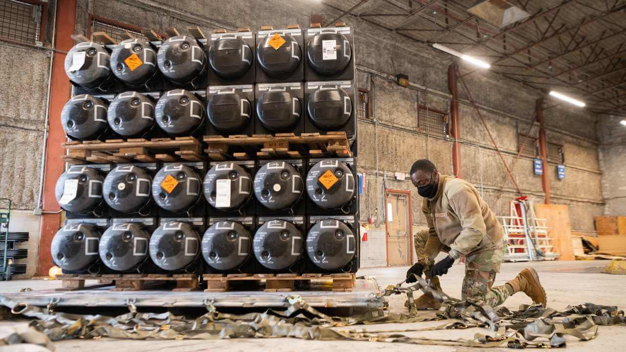 Photo: Airmen and civilians from the 436th Aerial Port Squadron prepare cargo in support of Ukraine at Dover Air Force Base, Delaware. Credit: US Department of Defense via Twitter