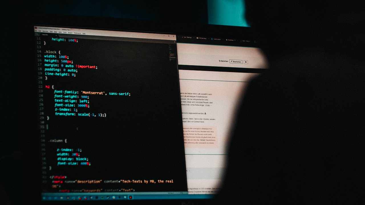 Photo: Someone programming a website in HTML. Credit: Mika Baumeister via Unsplash.