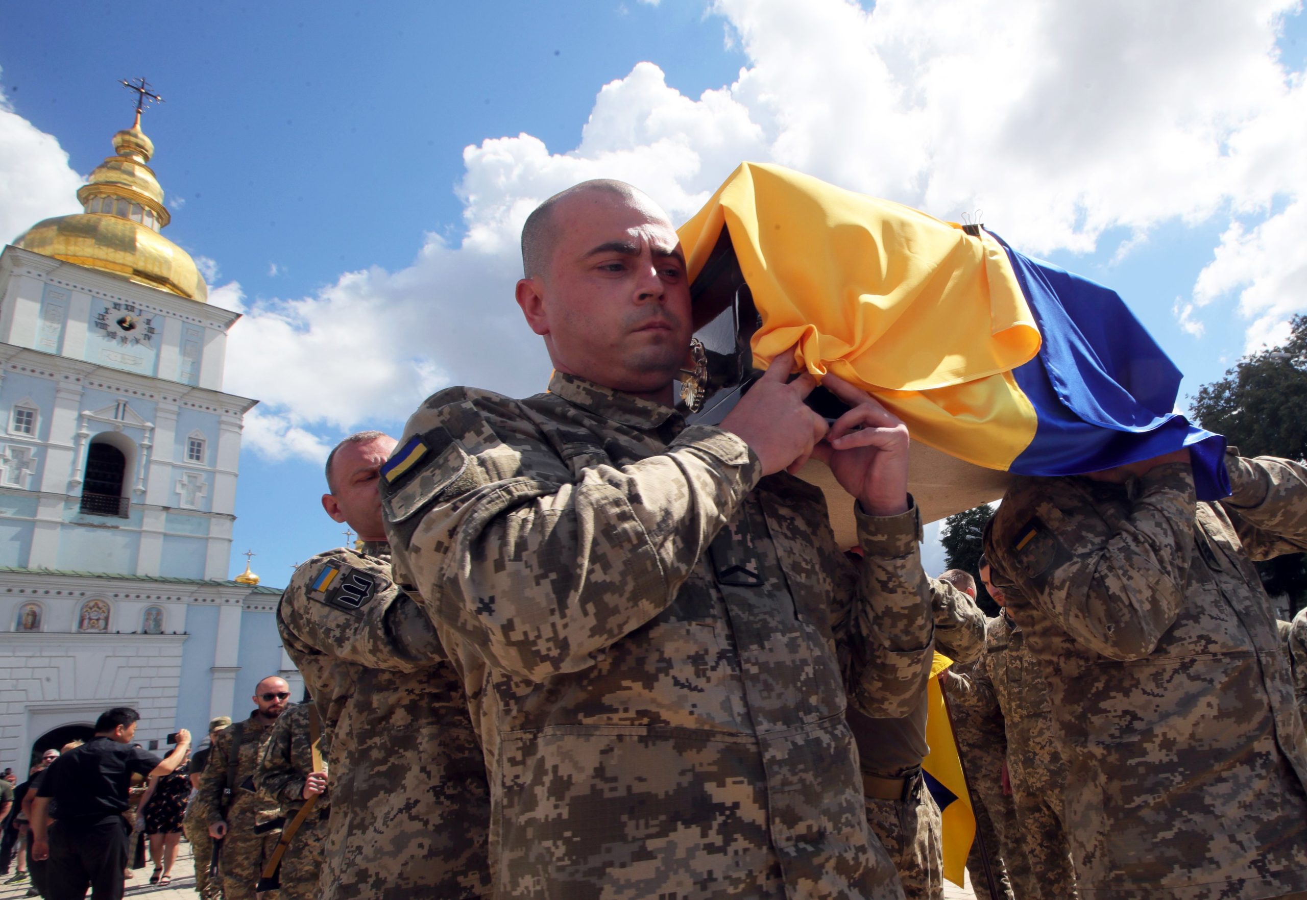 Photo: KYIV, UKRAINE - JULY 18, 2022 - Soldiers carry the coffin covered with a Ukrainian flag with the body of the 93rd Independent Kholodnyi Yar Mechanized Brigade serviceman known by his nom de guerre 'Fanat' after a memorial service at St Michael's Cathedral, Kyiv, capital of Ukraine. Credit: Pavlo_Bagmut via Reuters Connect