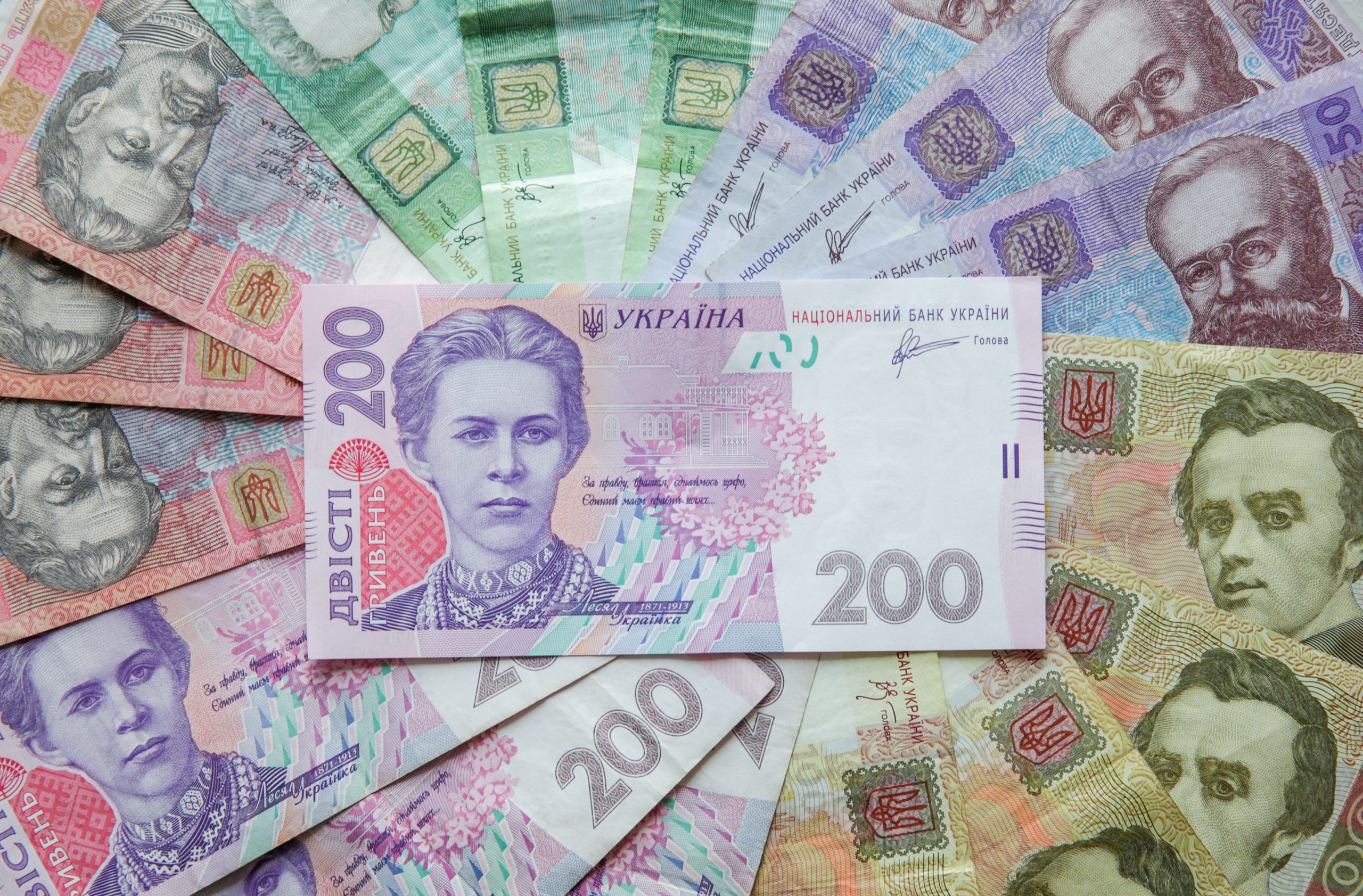 Photo: Ukrainian hryvnia banknotes are seen in a photo illustration shot in Kiev, Ukraine, August 6, 2014. Credit: REUTERS/Konstantin Chernichkin/Ullustration/File Photo
