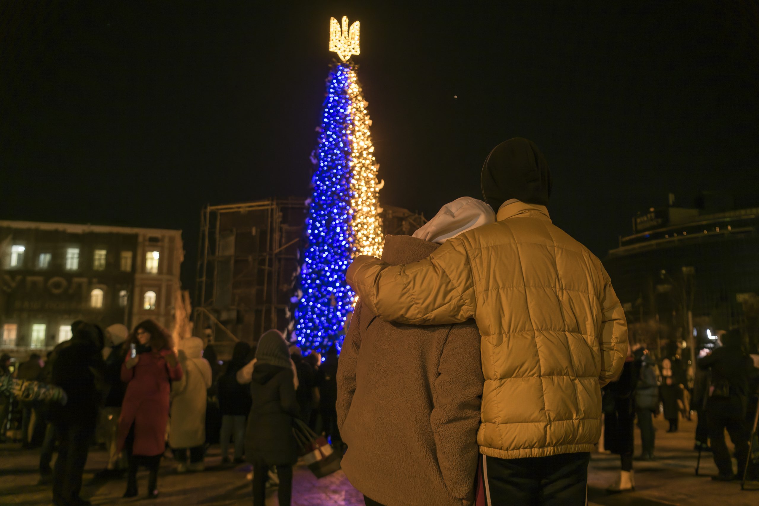 People take photos the Christmas tree at the Sofiyska Square in Kyiv, Ukraine, December 19, 2022. Credit: Maxym Marusenko/NurPhoto