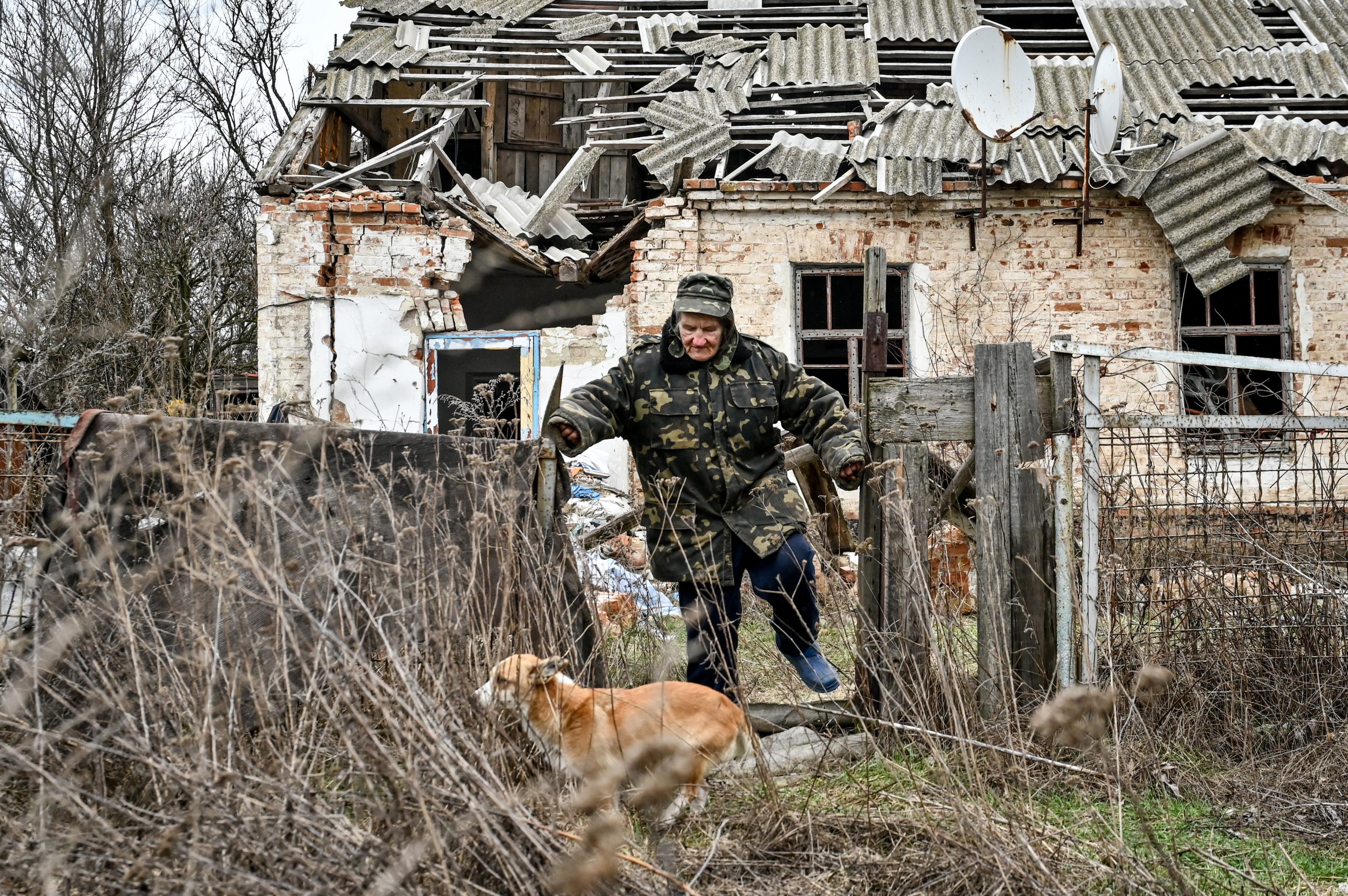 Photo: An old man and a dog are pictured outside a home destroyed in the shelling of Russian troops, Zaliznychne village, Zaporizhzhia Region, southeastern Ukraine. Credit:Dmytro Smolienko/NURPHOTO via Reuters Connect.