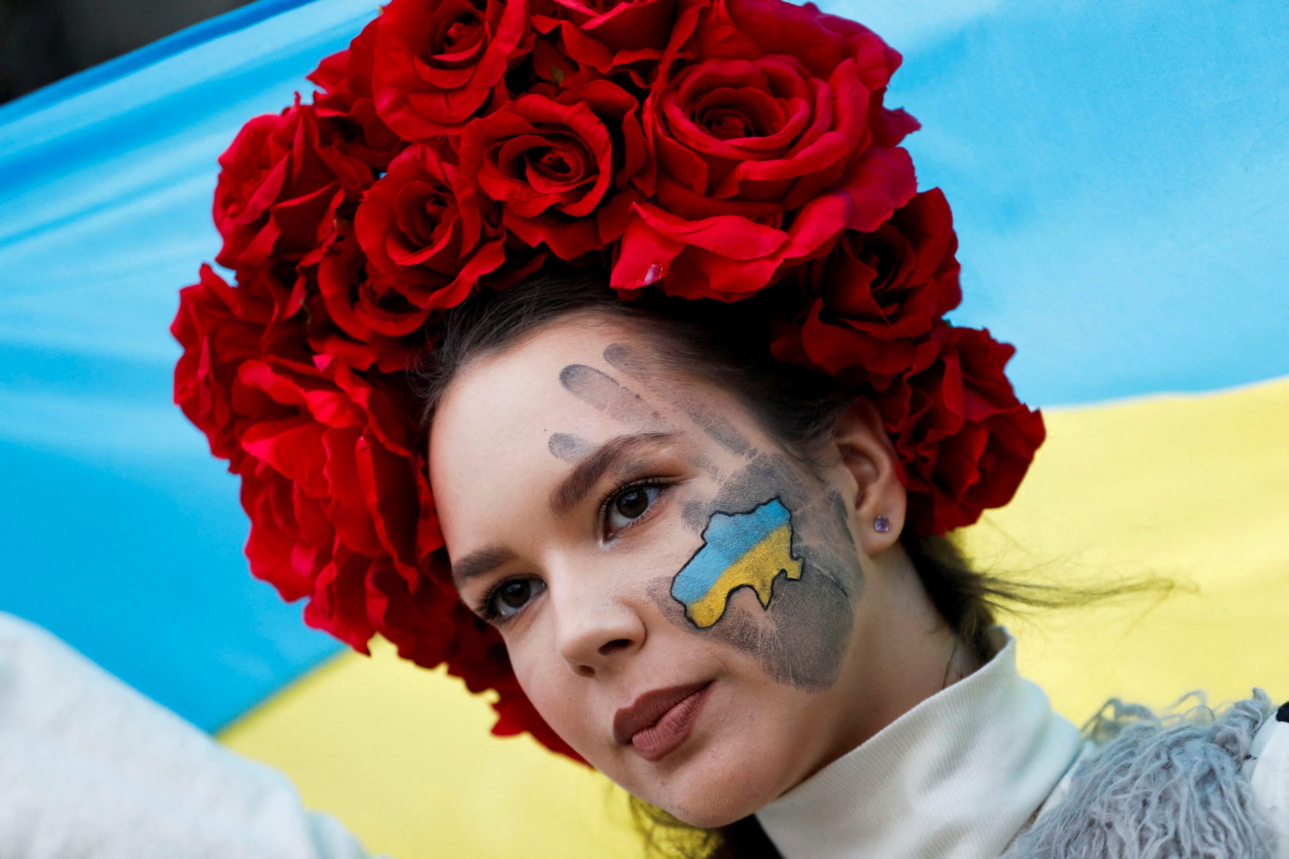 Photo: A Ukrainian woman takes part in a solidarity march to mark the first anniversary of the Russian invasion of Ukraine, in Budapest, Hungary, February 24, 2023. Credit: REUTERS/Bernadett Szabo