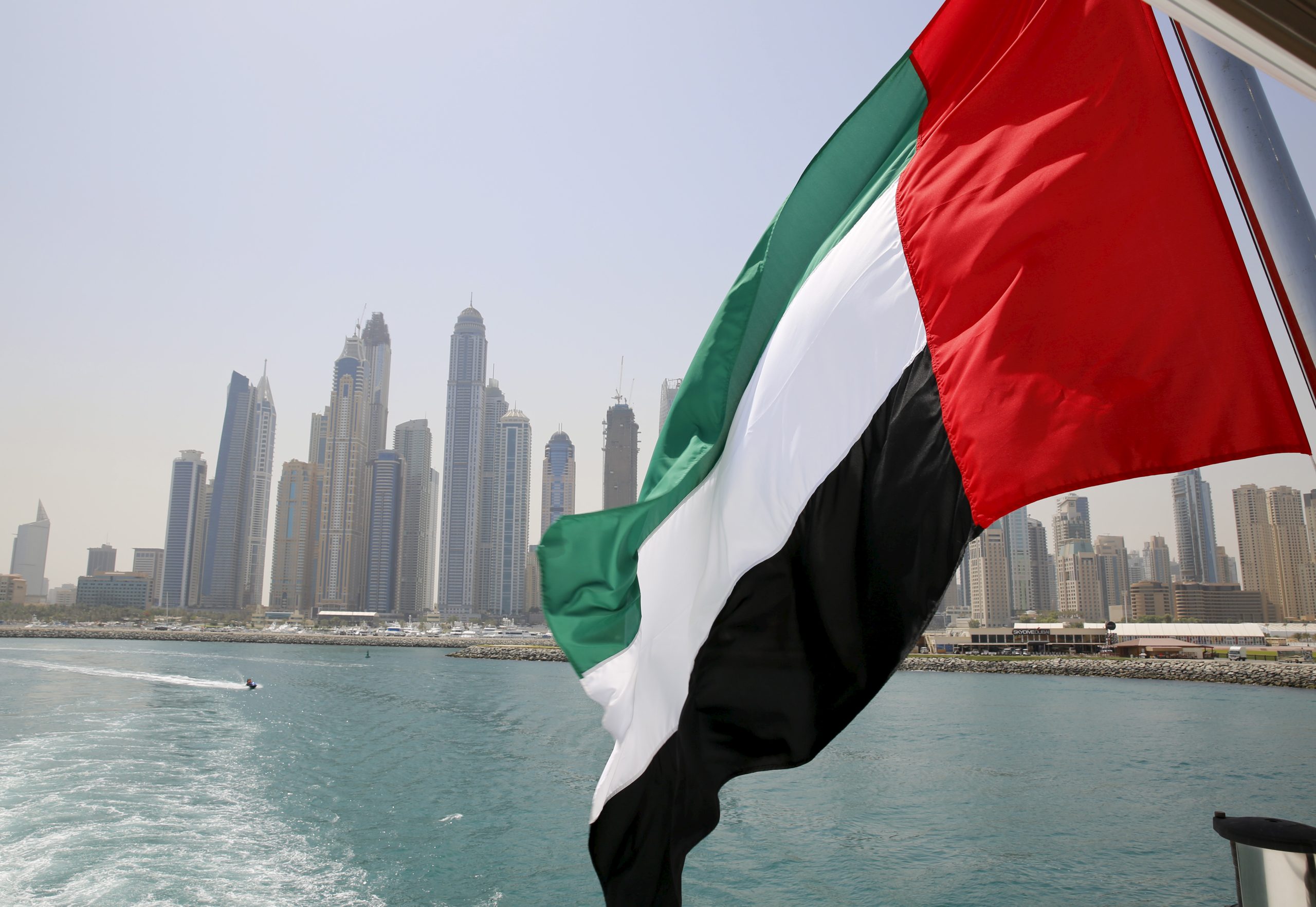 Photo: UAE flag flies over a boat at Dubai Marina, Dubai, United Arab Emirates May 22, 2015. Credit: REUTERS/Ahmed Jadallah